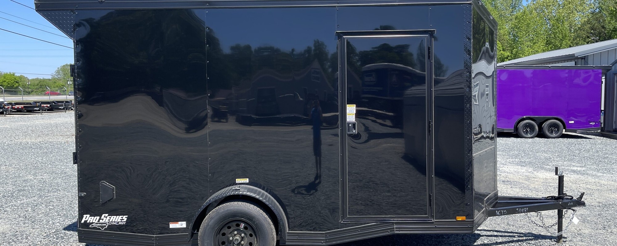 Blackout Cynergy Pro Series 6x12 enclosed cargo trailer with a side door on the NC Trailers lot