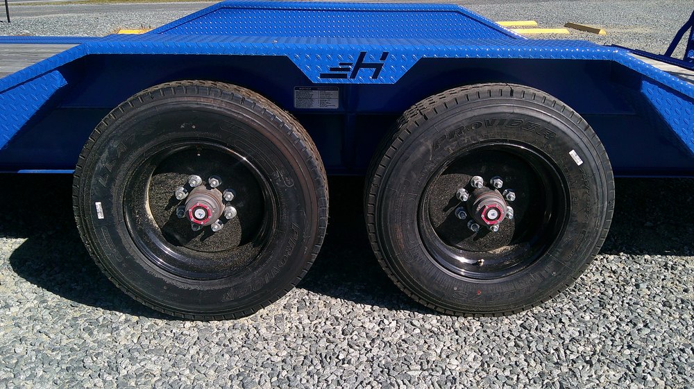 Tandem axles, hubs and 17.5 inch wheels under a Horizon equipment trailer at NC Trailers