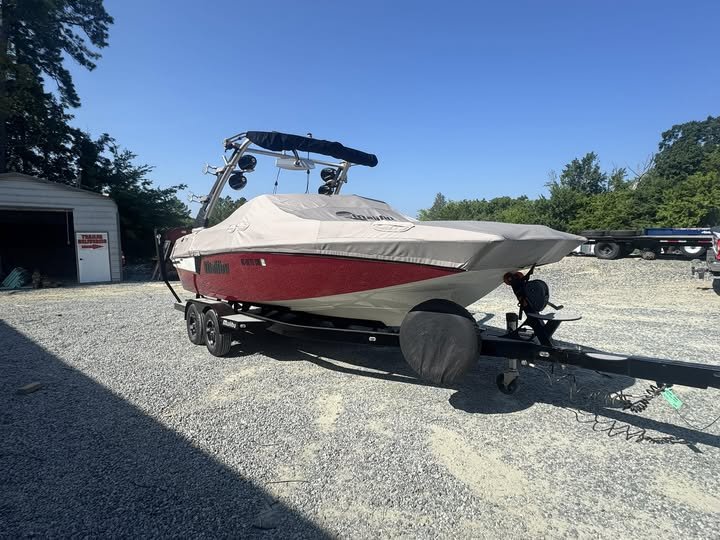 Boat on a tandem axle boat trailer at NC Trailers for service